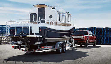 2022 Nissan TITAN Truck towing boat | Vann York's High Point Nissan in High Point NC